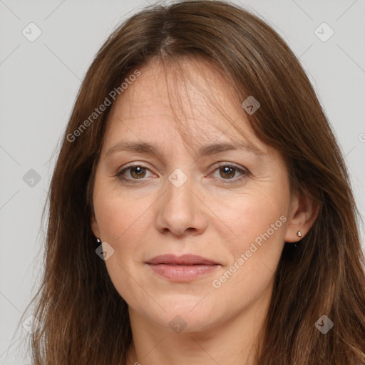 Joyful white adult female with long  brown hair and brown eyes