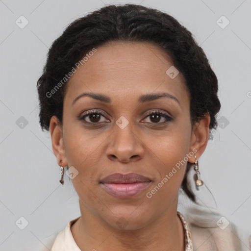 Joyful black adult female with short  brown hair and brown eyes