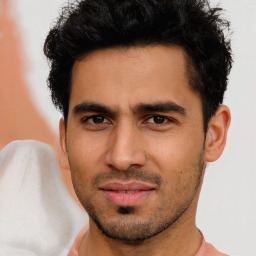 Joyful latino young-adult male with short  brown hair and brown eyes