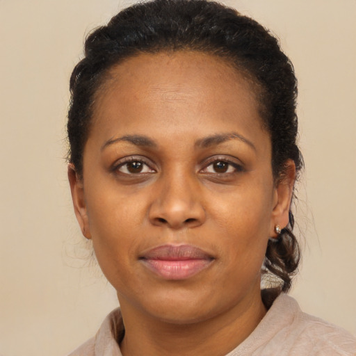 Joyful latino adult female with short  brown hair and brown eyes