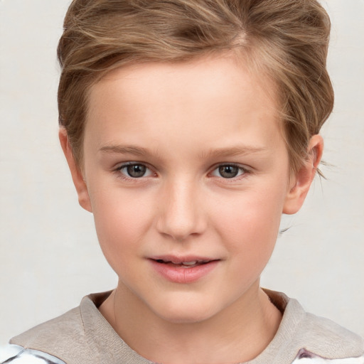 Joyful white child female with short  brown hair and brown eyes