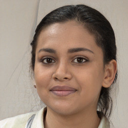 Joyful white young-adult female with medium  brown hair and brown eyes