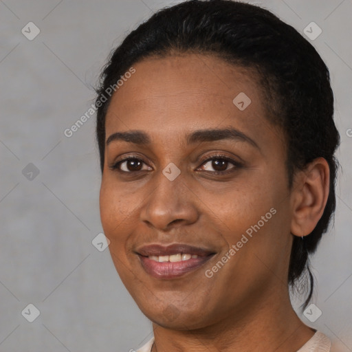 Joyful black young-adult female with medium  black hair and brown eyes