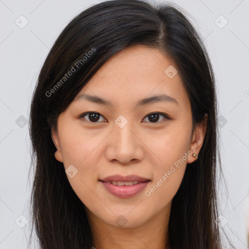 Joyful asian young-adult female with long  brown hair and brown eyes