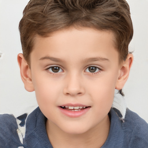 Joyful white child male with short  brown hair and brown eyes