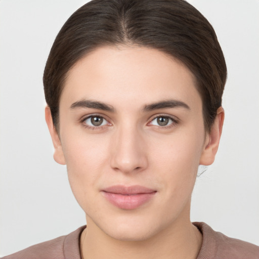 Neutral white young-adult female with short  brown hair and brown eyes