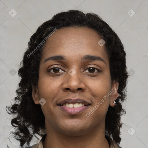 Joyful black young-adult female with long  black hair and brown eyes