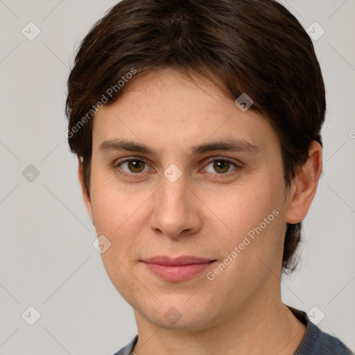 Joyful white young-adult female with short  brown hair and grey eyes