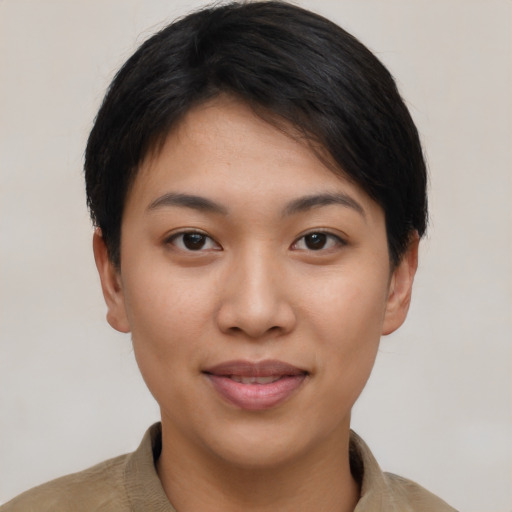 Joyful asian young-adult female with short  black hair and brown eyes