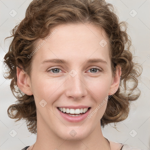 Joyful white young-adult female with medium  brown hair and green eyes