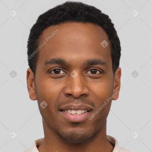 Joyful black young-adult male with short  brown hair and brown eyes