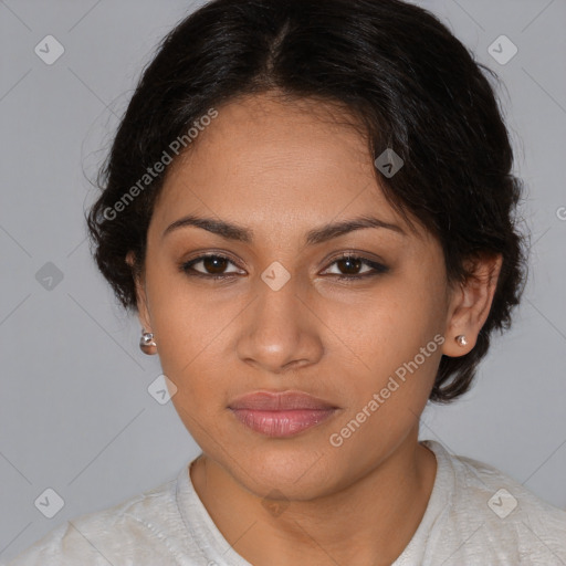 Joyful latino young-adult female with medium  brown hair and brown eyes