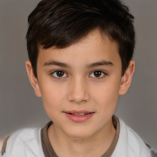 Joyful white child male with short  brown hair and brown eyes