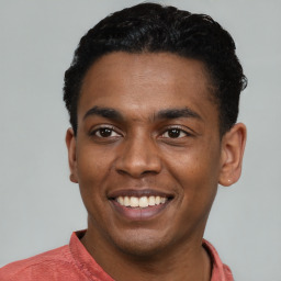 Joyful latino young-adult male with short  black hair and brown eyes