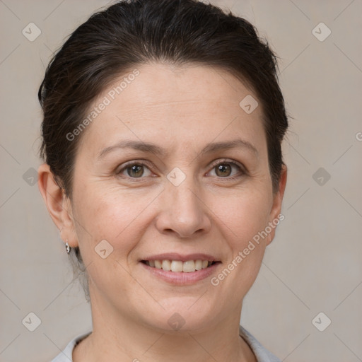 Joyful white adult female with short  brown hair and brown eyes