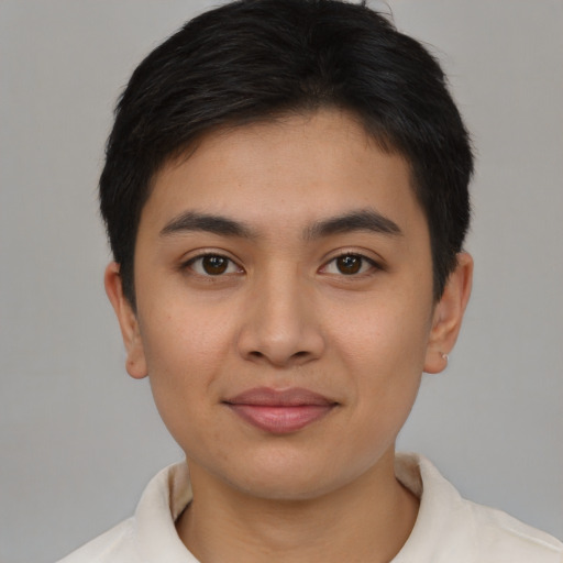 Joyful asian young-adult male with short  brown hair and brown eyes