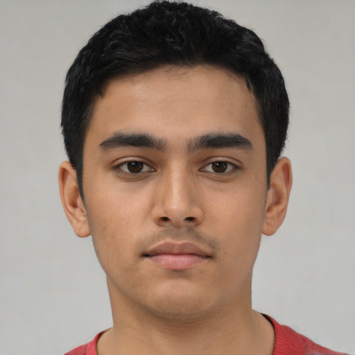 Neutral latino young-adult male with short  black hair and brown eyes
