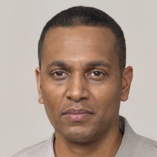 Neutral black adult male with short  black hair and brown eyes