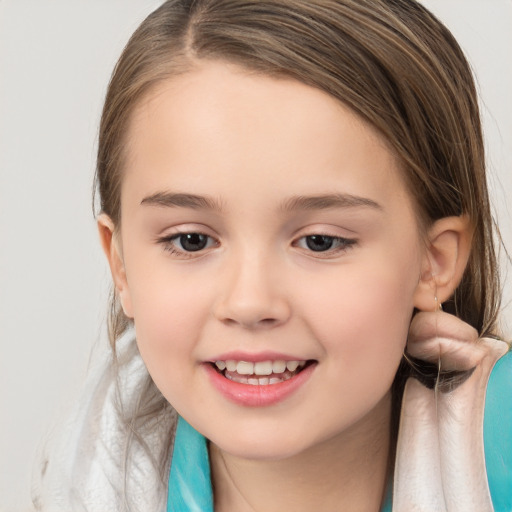 Joyful white child female with medium  brown hair and brown eyes