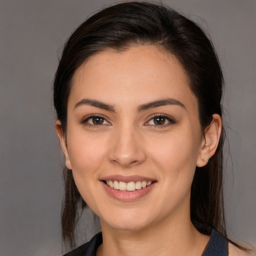 Joyful white young-adult female with medium  brown hair and brown eyes