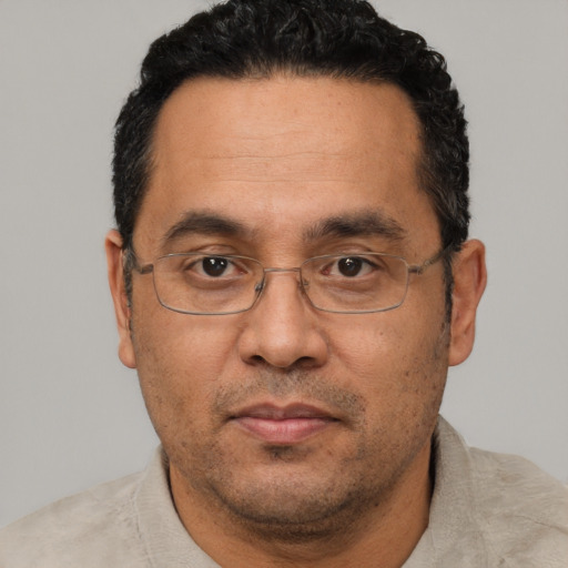 Neutral white adult male with short  black hair and brown eyes