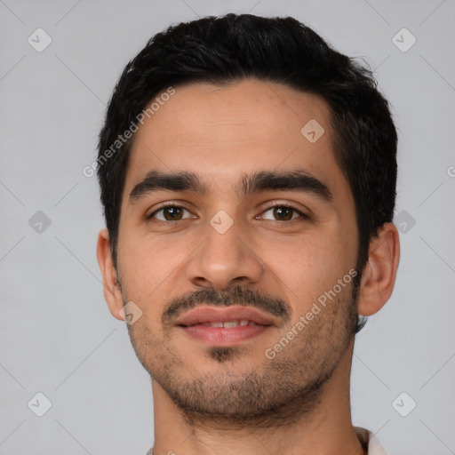 Joyful latino young-adult male with short  black hair and brown eyes