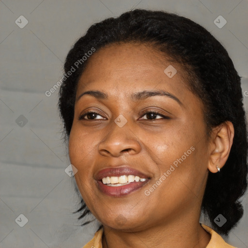 Joyful black adult female with short  brown hair and brown eyes