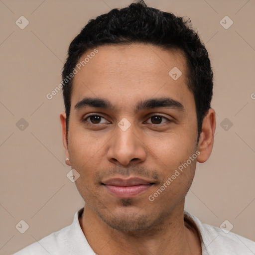 Joyful latino young-adult male with short  black hair and brown eyes