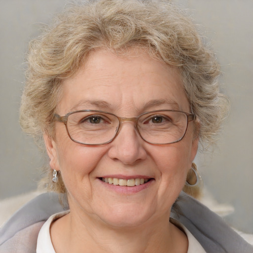 Joyful white middle-aged female with medium  brown hair and blue eyes