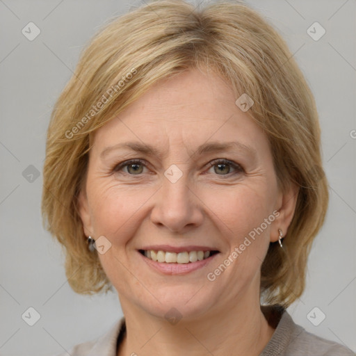 Joyful white adult female with medium  brown hair and grey eyes