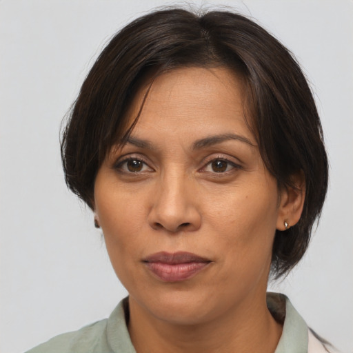Joyful asian adult female with medium  brown hair and brown eyes