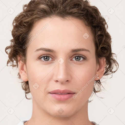 Joyful white young-adult female with medium  brown hair and green eyes