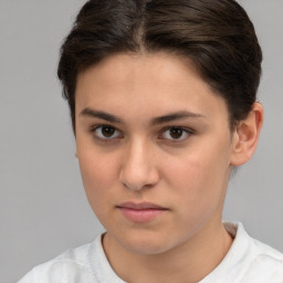 Neutral white young-adult female with short  brown hair and brown eyes