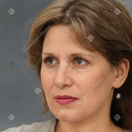 Joyful white adult female with medium  brown hair and grey eyes