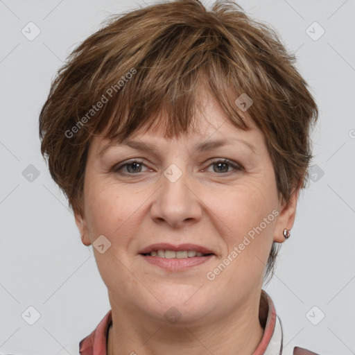 Joyful white adult female with short  brown hair and brown eyes