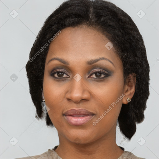 Joyful black adult female with medium  brown hair and brown eyes