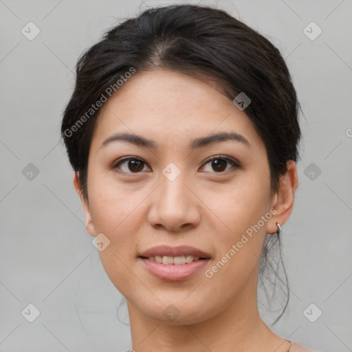 Joyful asian young-adult female with short  brown hair and brown eyes