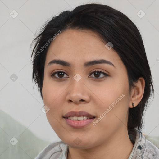 Joyful asian young-adult female with medium  black hair and brown eyes