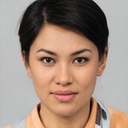 Joyful asian young-adult female with medium  brown hair and brown eyes