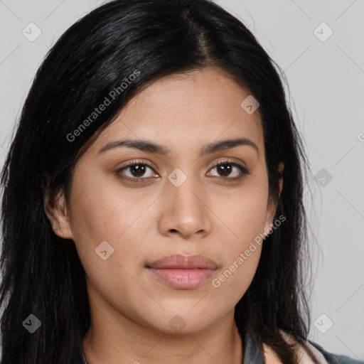 Joyful latino young-adult female with long  brown hair and brown eyes