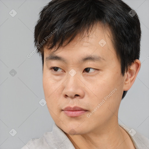 Neutral asian young-adult male with short  black hair and brown eyes