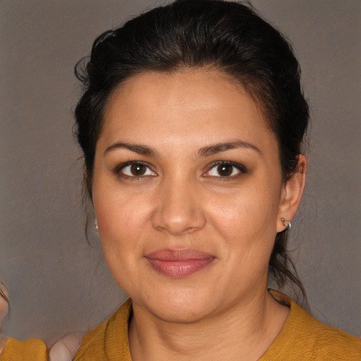 Joyful white young-adult female with medium  brown hair and brown eyes