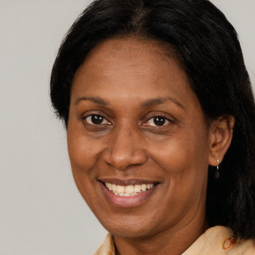 Joyful latino adult female with short  brown hair and brown eyes