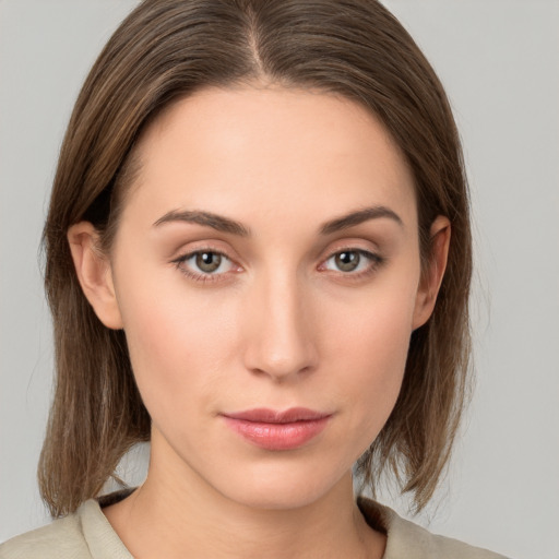 Neutral white young-adult female with medium  brown hair and grey eyes