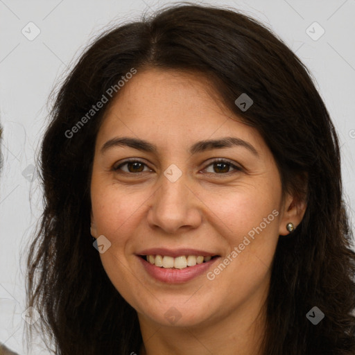 Joyful white adult female with long  brown hair and brown eyes