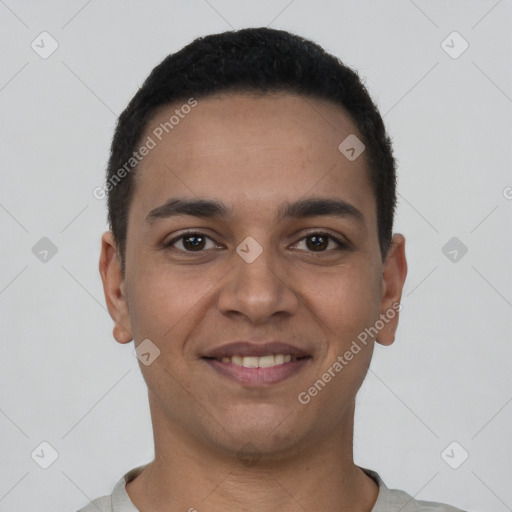 Joyful latino young-adult male with short  brown hair and brown eyes