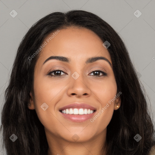 Joyful latino young-adult female with long  brown hair and brown eyes