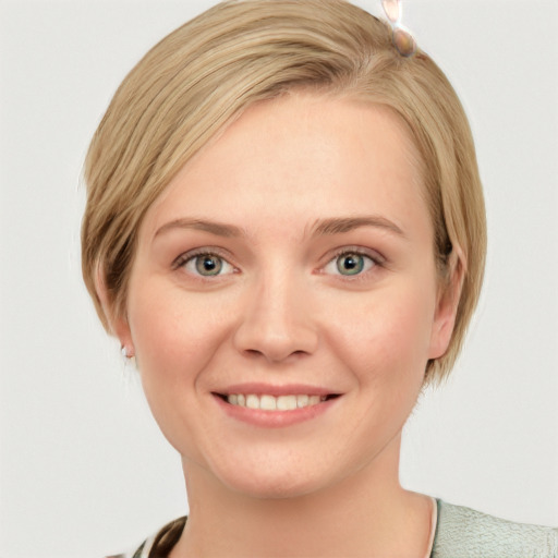 Joyful white young-adult female with medium  brown hair and blue eyes