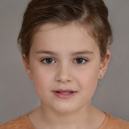 Joyful white child female with short  brown hair and brown eyes