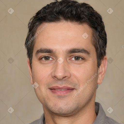 Joyful white young-adult male with short  black hair and brown eyes